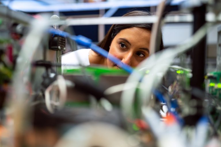 Remote Labs TU/e woman looking at machine